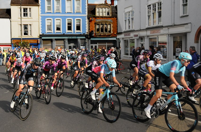 Large group of women cyclists rounding the Plain roundabout in Oxford on The Womens Tour 2021