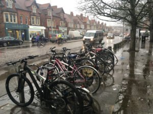 Summertown main road. Shops with bikes in foreground