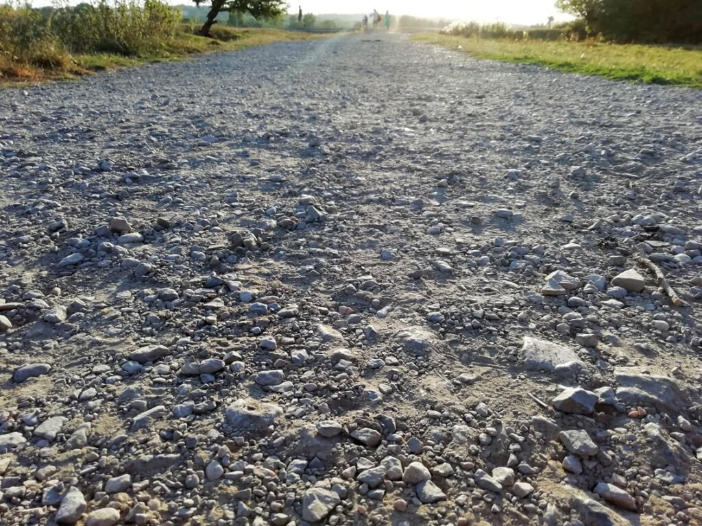 Path of loose broken stone viewed at ground level