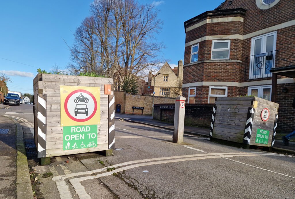 Wooden road blocks marking entrance to low traffic neighbourhood